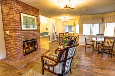 Warm and inviting common area with seating and artwork