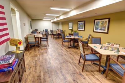 Bright activity room with tables and chairs