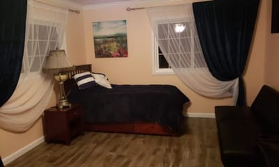 Cozy bedroom with a bed and seating area