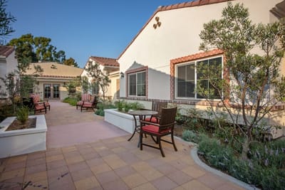 Outdoor shaded seating area with gardens