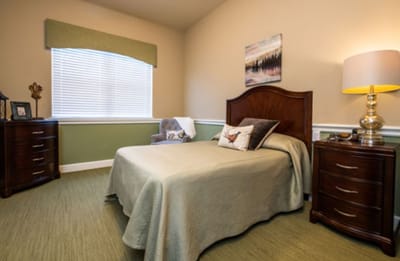 Private resident room with bed and furniture