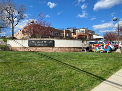 Exterior view of Spang Crest Manor with sign