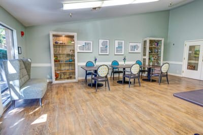 Bright and inviting common area with tables and chairs