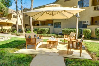 Outdoor seating area with shade and furniture