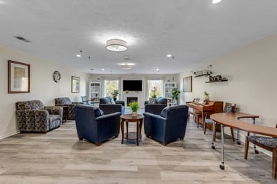 Bright common area with seating and piano