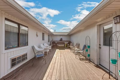 Outdoor patio area with seating and planters