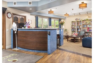 Reception area with seating and bookshelves