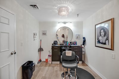 Interior of a beauty salon with styling chair and mirror