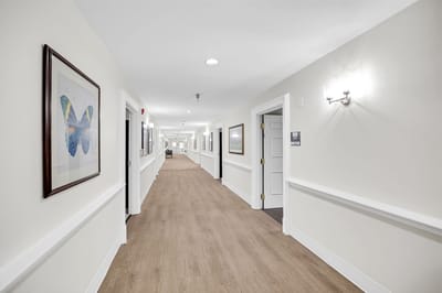 Empty corridor with artwork on the walls