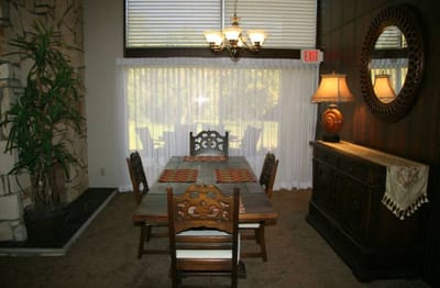 Interior dining room with wooden table and chairs