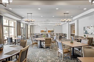 Bright dining area with tables and chairs
