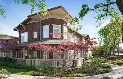 Exterior view of a senior living facility with landscaping