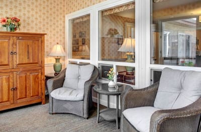 Cozy common area with chairs and lamps