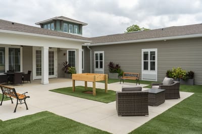 Outdoor seating area with a lawn and patio space