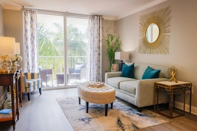Bright living room with modern decor and balcony view