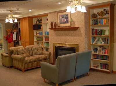 Cozy common area with seating and bookshelves