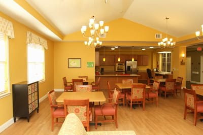 Dining area with tables and chairs in a warm interior