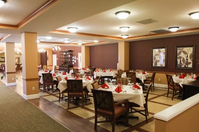 Dining room setup with tables and chairs
