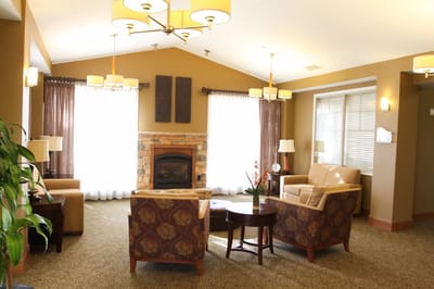 Bright and cozy common area with seating and decor