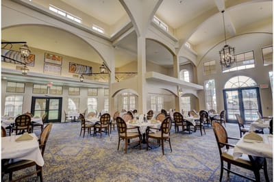Elegant dining room with tables set for meals