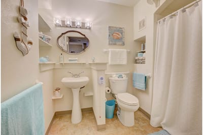 Bright and clean restroom with light decor and fixtures