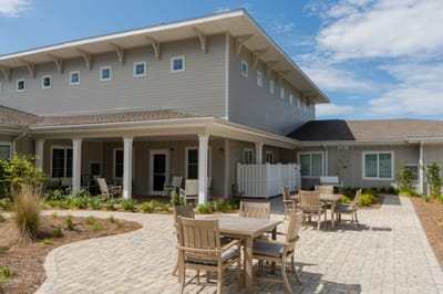 Outdoor patio area with seating near the facility