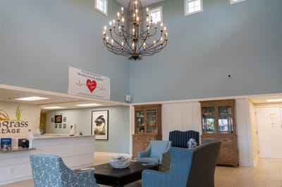 Bright lobby area with modern decor and chandelier