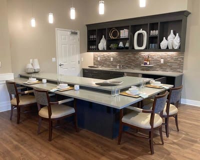 Dining area with elegant table settings in a communal kitchen