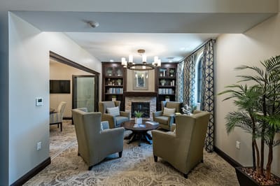 Cozy lounge area with seating and bookshelves