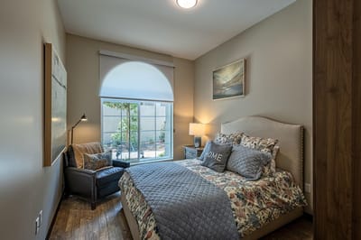 Cozy resident room with a bed and seating area