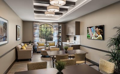 Bright interior common area with seating and artwork