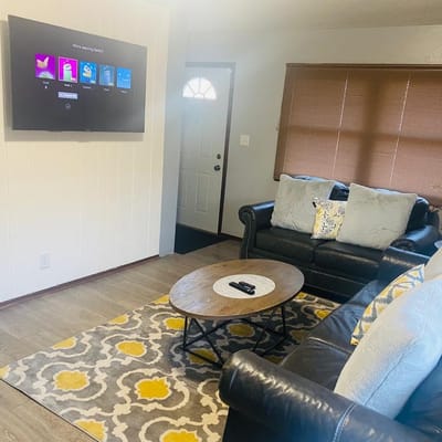 Cozy interior lounge area with a sofa and TV