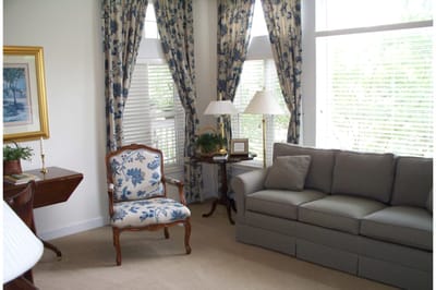 Bright interior lounge with floral decor and comfortable seating