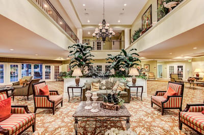Interior view of a common area with seating and plants