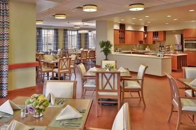 Bright dining room with wooden tables and vibrant decor
