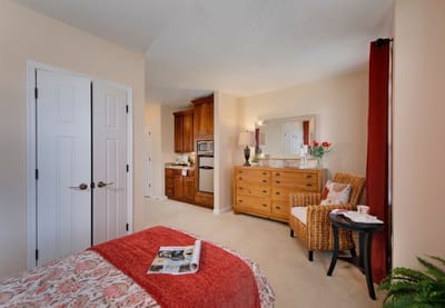Cozy resident room with a bed and seating area