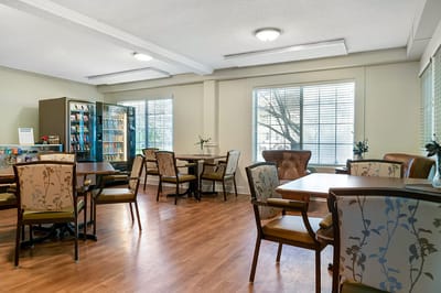Bright common area with tables and chairs