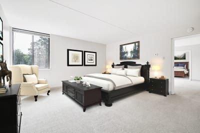 Bright and spacious elderly bedroom with neutral decor