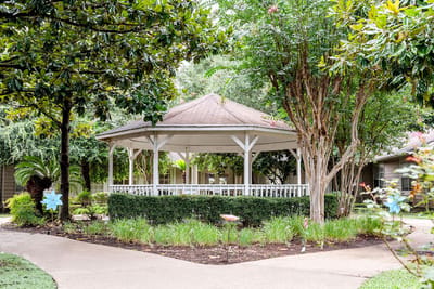 A gazebo in a landscaped outdoor space