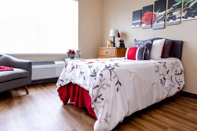Cozy resident room with a bed and decorative accents