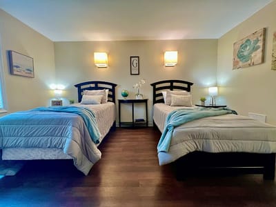 Well-furnished shared resident room with twin beds