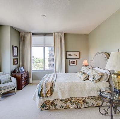 Cozy resident room with floral decor and window view