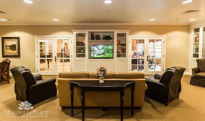 Common area with seating and a television screen