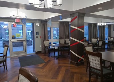 Interior view of a dining area with tables and chairs