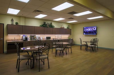 Bright common area with tables and chairs