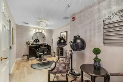 Interior view of a beauty salon with styling stations