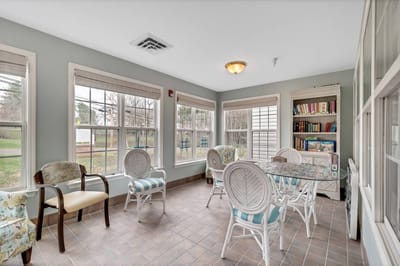 Bright common area with seating and tables