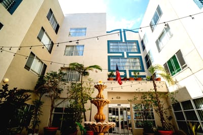 Courtyard with a fountain and potted plants