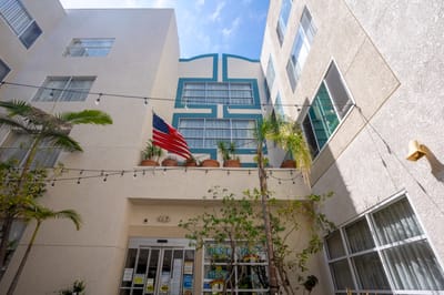 Outdoor view of facility entrance with American flag