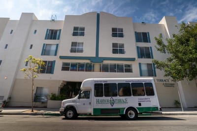 Transit bus parked in front of the facility